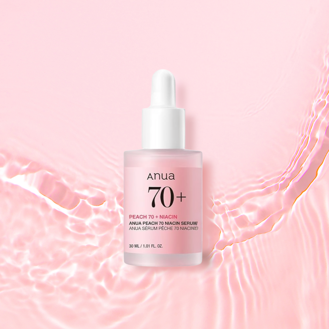 Anua Peach 70 Niacin Serum bottle on a pink background