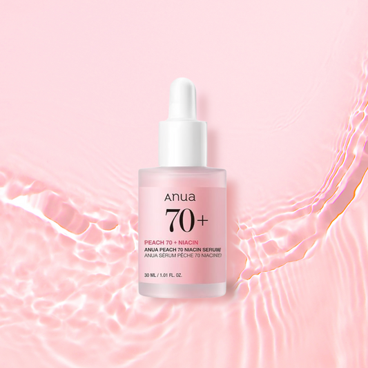 Anua Peach 70 Niacin Serum bottle on a pink background