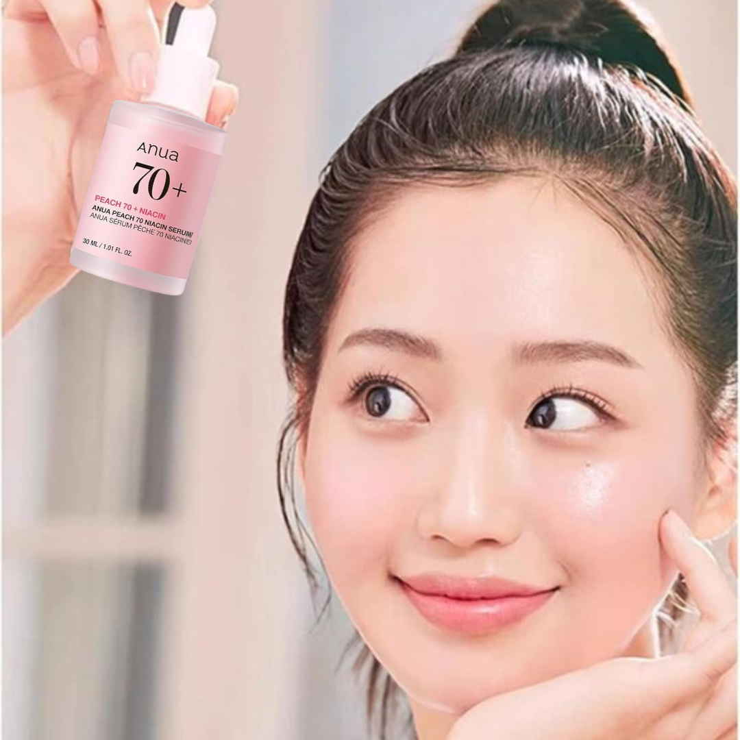 Woman holding Anua Peach 70 Niacin Serum bottle