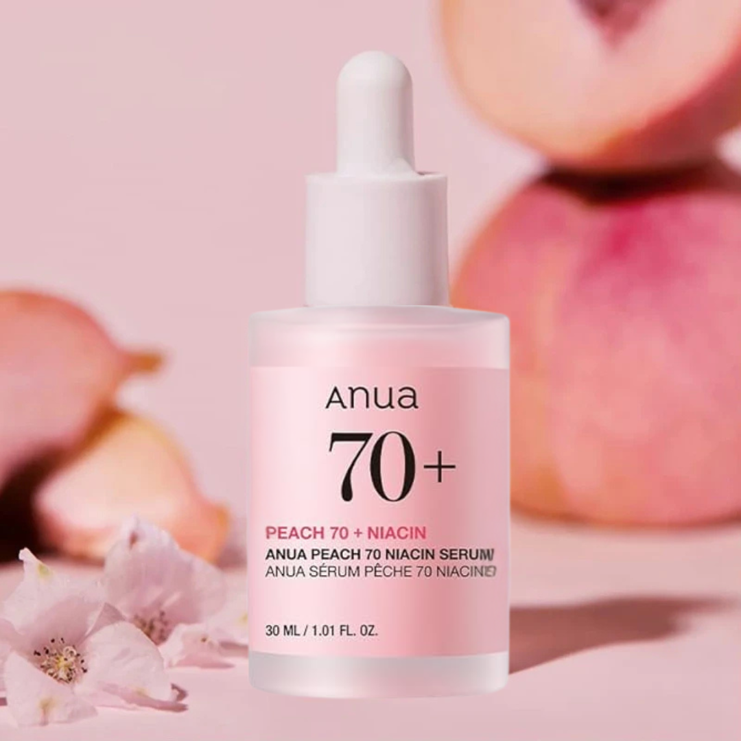 Anua Peach 70+ Niacin serum bottle with peaches in the background