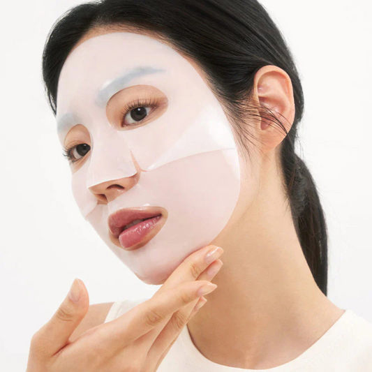 Woman applying Biodance Hydro Cera Nol Real Deep Mask with a white background