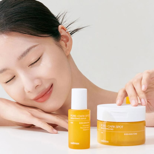 Woman in the background with Celimax Pore+Dark Spot Brightening Pad and Celimax Pore+Dark Spot Brightening Serum in the foreground