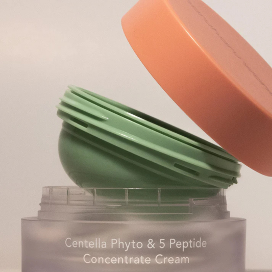 Haruharu Wonder Centella Phyto & 5 Peptide Concentrate Cream Refill close up being inserted in the original container.
