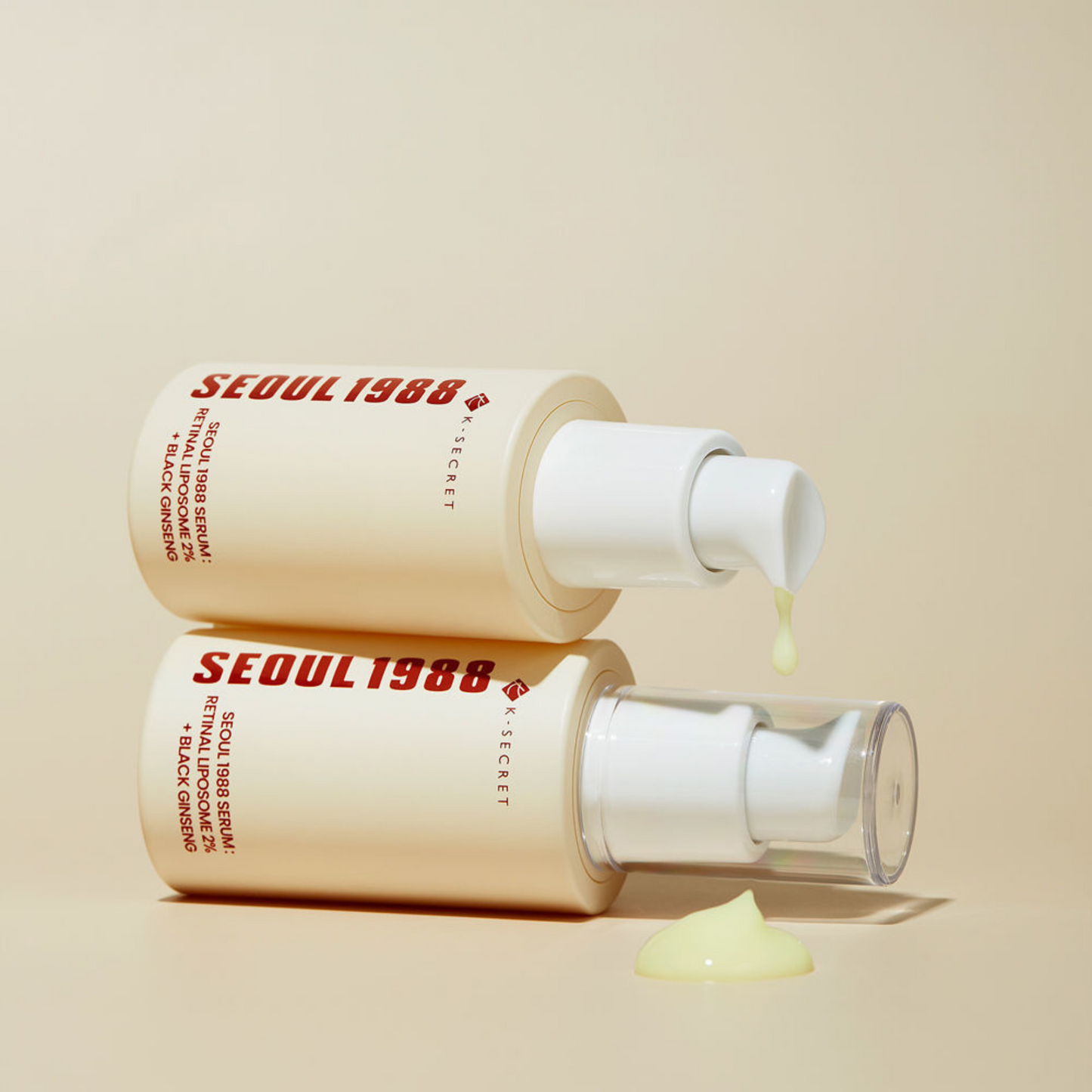 Two K-Secret SEOUL 1988 Serum: Retinal Liposome 2% + Black Ginseng bottles on a beige background