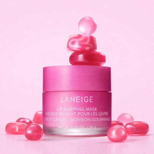 Pink Laneige lip sleeping mask with pink candies on a light pink background