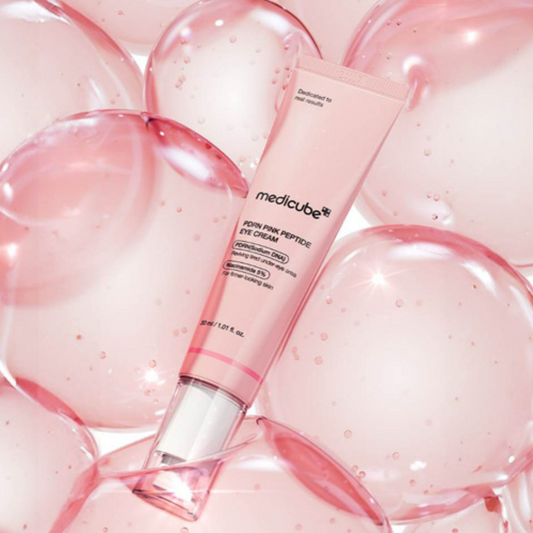 Medicube PDRN Pink Peptide Eye Cream with 'medicube' branding on a pink bubble background