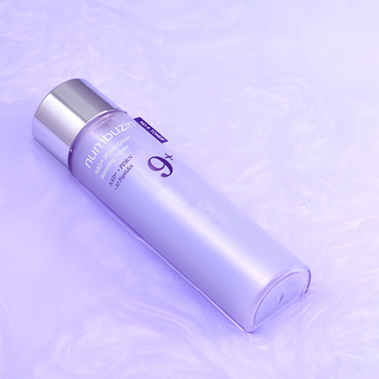 Numbuzin NAD+ PDRN Glow Boosting Toner floating in pearlescent violet toner.