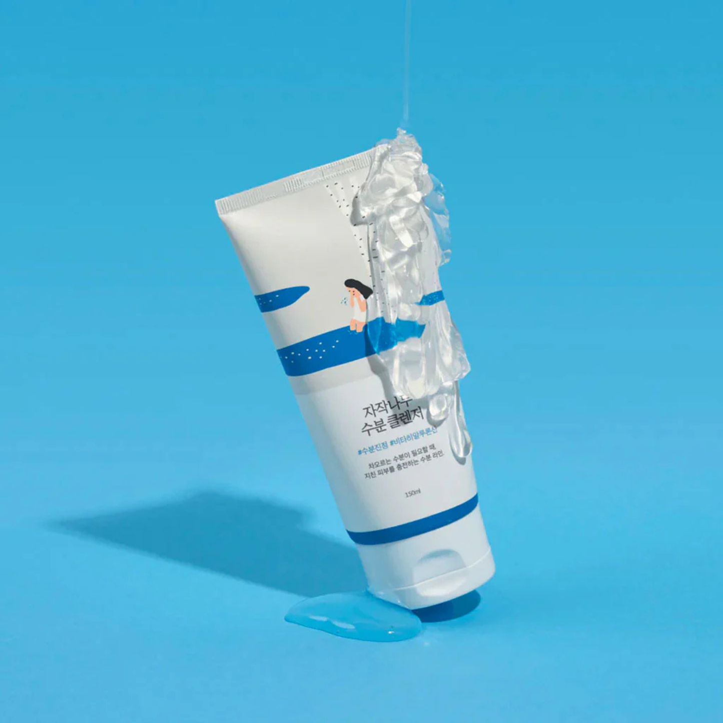 Tube of Round Lab Birch Juice Moisturizing Cleanser with blue label on a light blue background