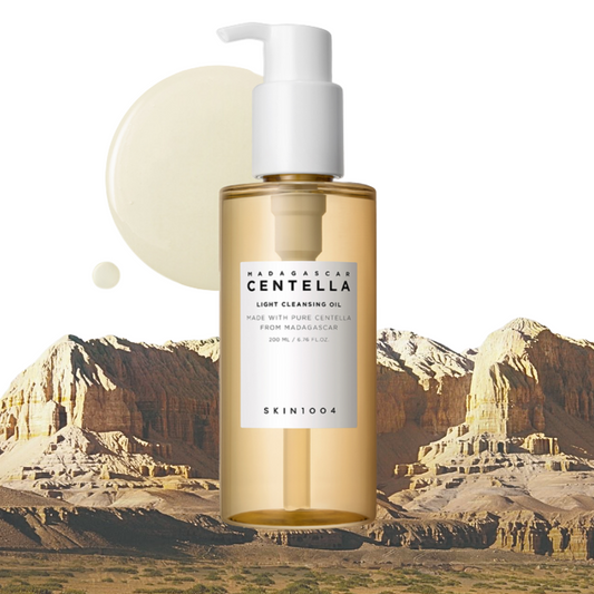 SKIN1004 Madagascar Centella Light Cleansing Oil with pump and 'SKIN1004' label against a desert landscape background