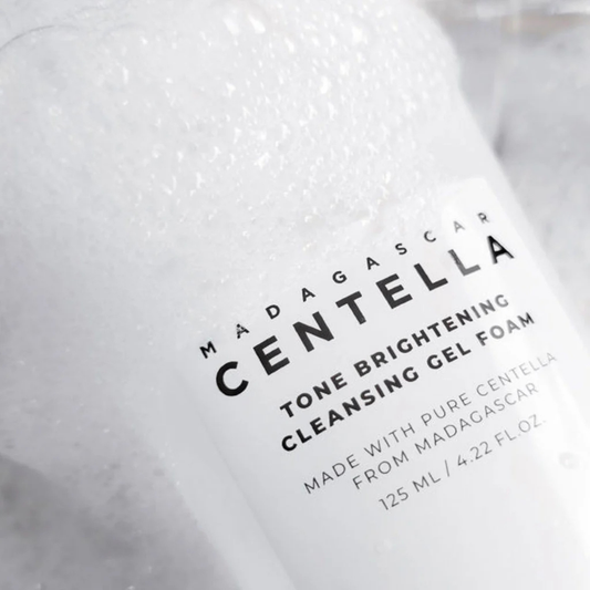 Close up of SKIN1004 Madagascar Centella Tone Brightening Cleansing Gel Foam with foam and bubbles