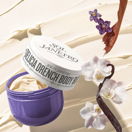 Sol de Janeiro Delicia Drench Body Balm with flowers and a horse bridle on a light background