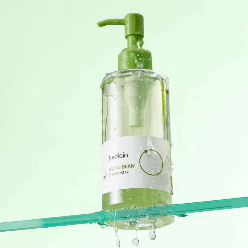 Bottle of beplain Mung Bean Cleansing Oil with a green pump on a light green background