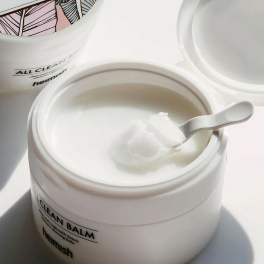 Open jar of heimish All Clean Balm with a spatula inside