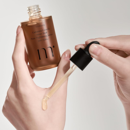 molvany Castanea Crenata Inner Shell Pore Tightening Serum with a dropper being used on a neutral background