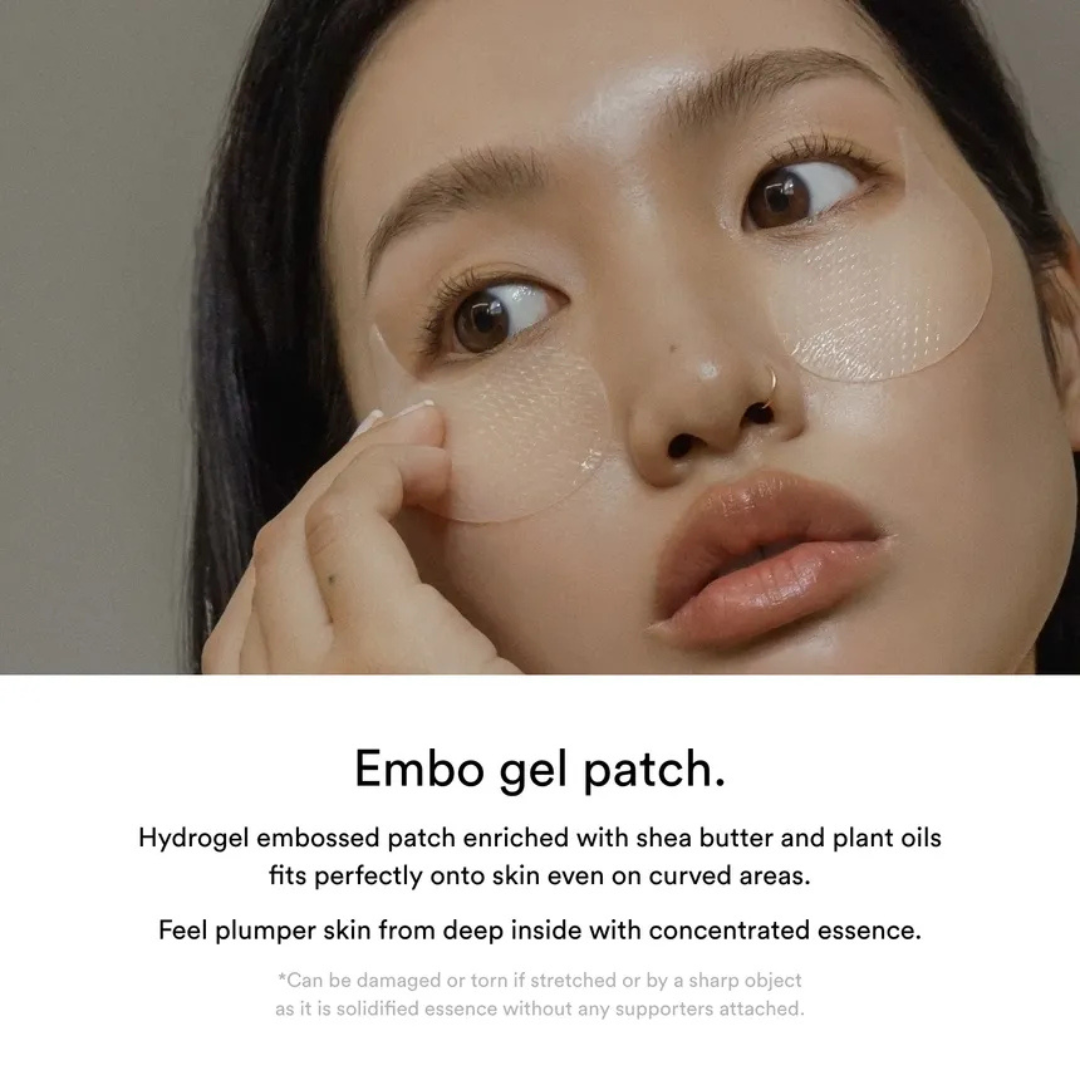Person wearing Embo gel patches on their face with a neutral background. Abib Collagen Eye Patch Jericho Rose Jelly