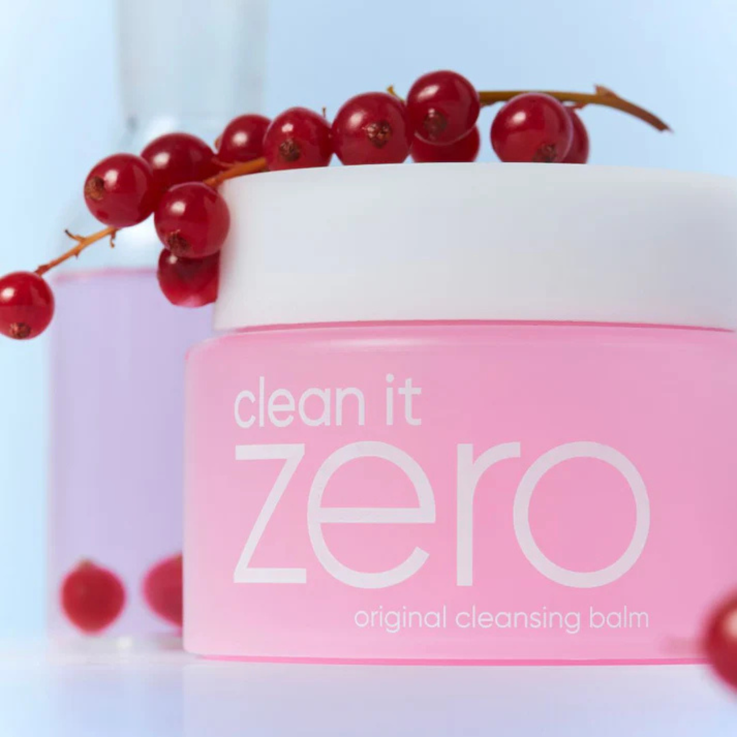 BANILA CO Clean It Zero Cleansing Balm Original lifestyle shot with Acerola berries draped over the jar