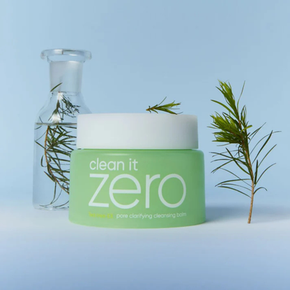 Jar of BANILA CO Clean It Zero Cleansing Balm Pore Clarifying with sprigs of Tea Tree