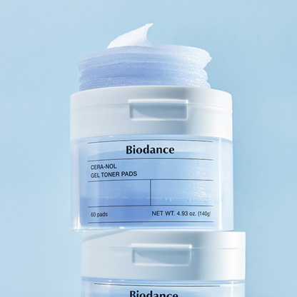 Biodance Cera-Nol Gel Toner Pads in a clear jar with a white lid and a blue-toned gel pad visible, shown against a light blue background with a second jar partially visible below.
