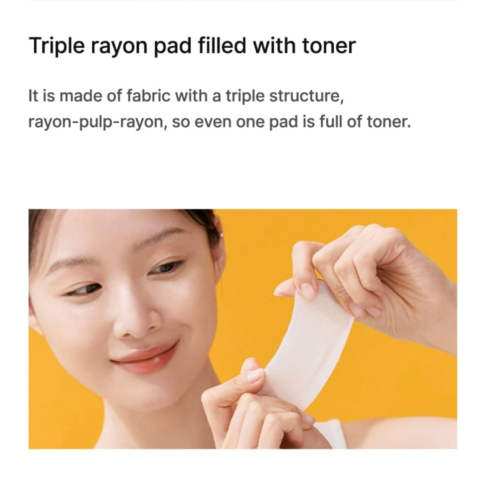 Person holding a Celimax Pore+Dark Spot Brightening Pad triple rayon pad filled with toner against a yellow background