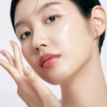 Close-up of a woman's face with a neutral background