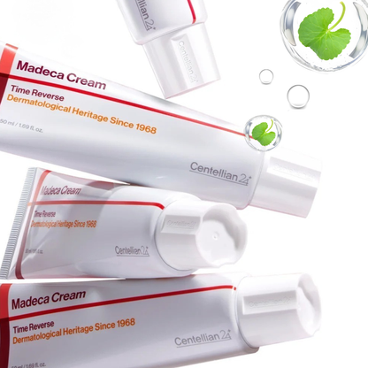 Multiple tubes of Centellian24 Madeca Cream Time Reverse with centella asiatica leaves in bubbles on a white background