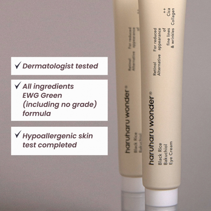 Two bottles of Haruharu Wonder Black Rice Bakuchiol Eye Cream with certification labels on a gray background