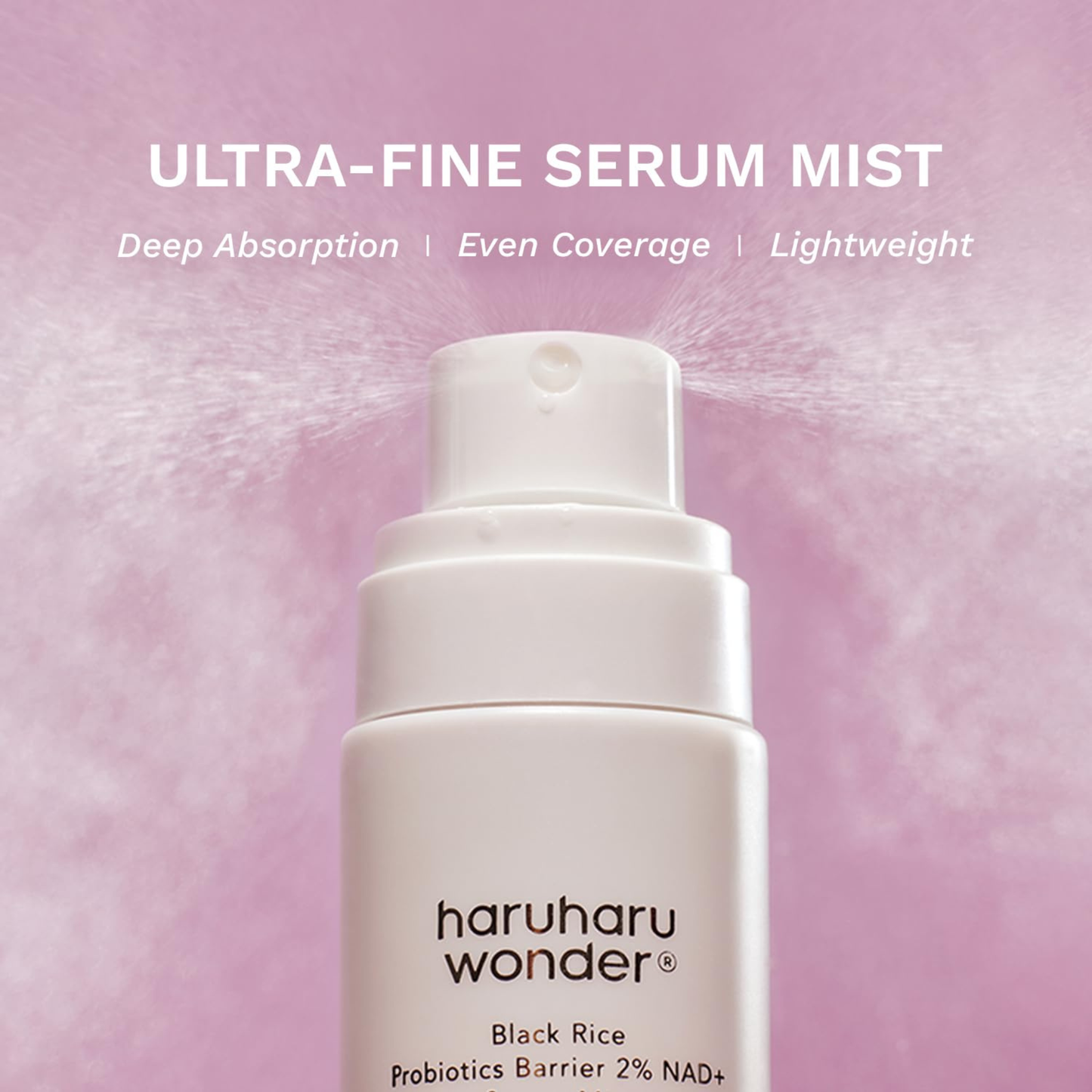 Haruharu Wonder Black Rice Probiotics Barrier 2% NAD+ Serum Mist close up showing the ultra fine mist spray on a pink background