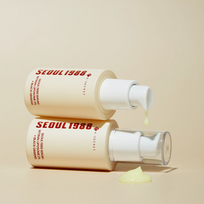 Two K-Secret SEOUL 1988 Serum: Retinal Liposome 2% + Black Ginseng bottles  on a beige background