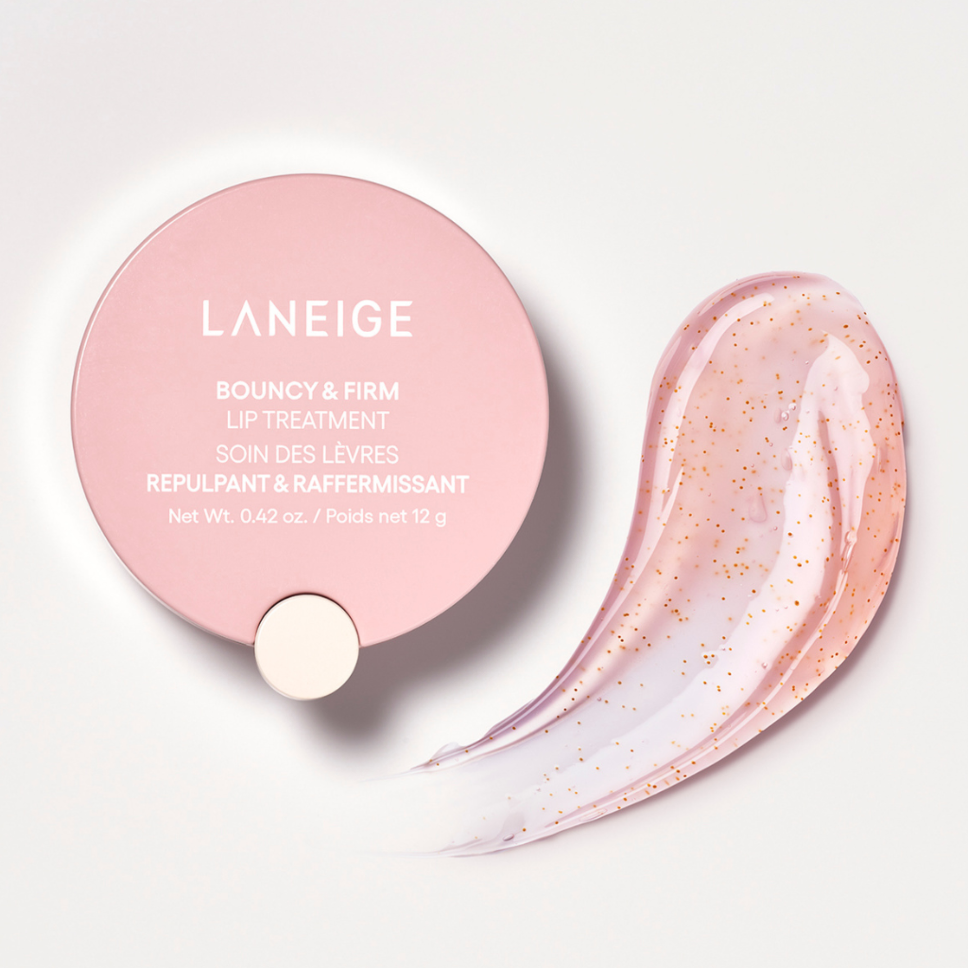 Laneige lip treatment with pink packaging and a swatch of product on a light background
