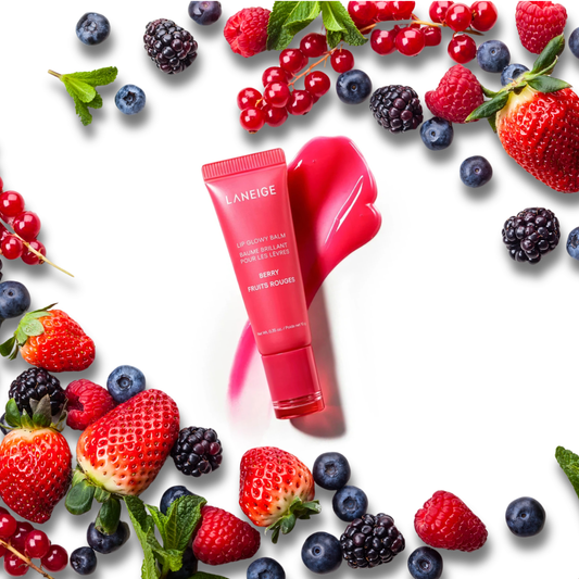 LANEIGE Lip Glowy Balm (Berry) surrounded by berries on a white background