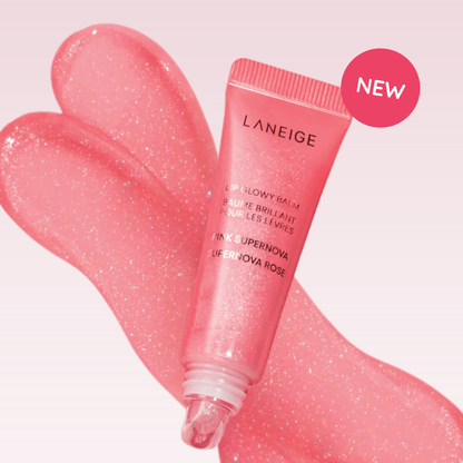 LANEIGE Lip Glowy Balm (Pink Supernova) with pink lip colour swatch on a gradient light pink background