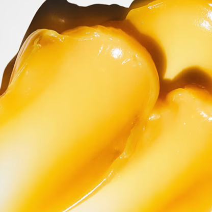 Close-up of a yellow fruit with a white background