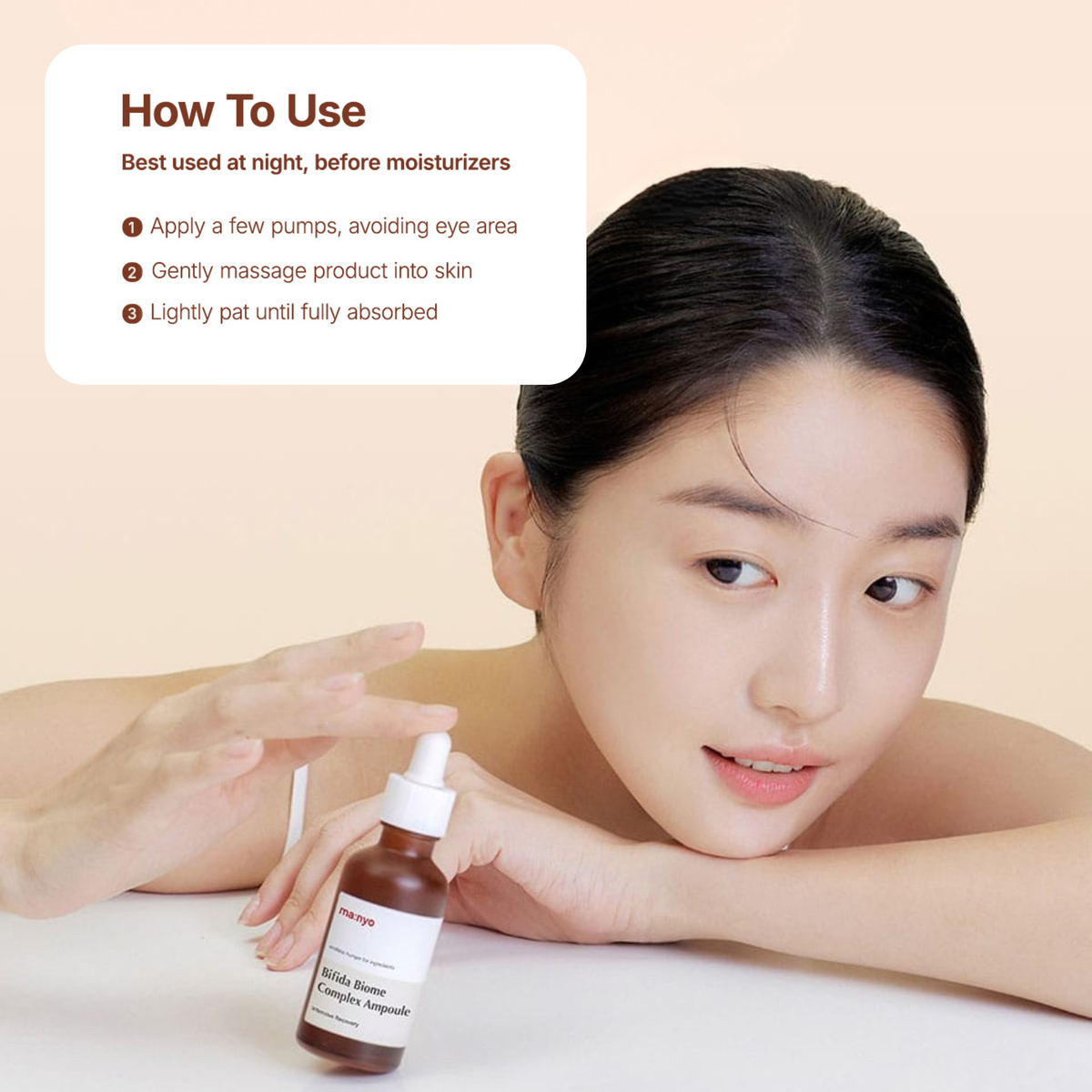 Woman holding the Ma:nyo Bifida Biome Complex Ampoule with usage instructions
