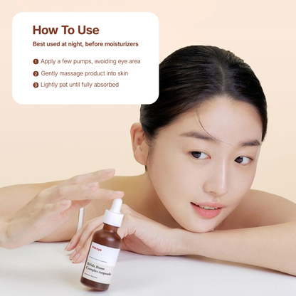 Woman holding the Ma:nyo Bifida Biome Complex Ampoule with usage instructions