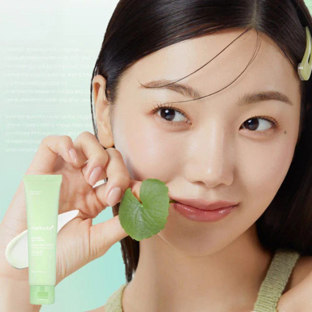 Woman holding a green leaf and Medicube Exosome Cica Cream with a light green background