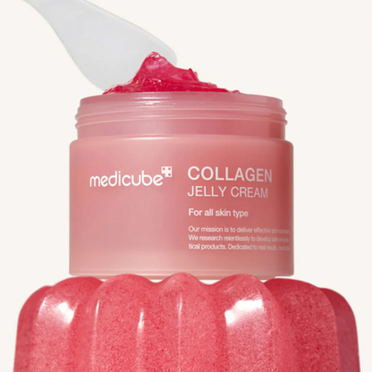 Pink Medicube Collagen Jelly Cream jar with a scoop on top of a pink moulded jelly on a white background