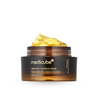 Opern Medicube Deep Vita C Capsule Cream jar with moisturiser on top on a white background