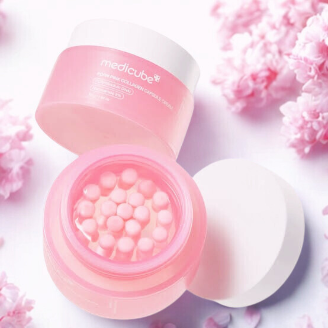 Medicube PDRN Pink Collagen Capsule Cream on a pink floral background