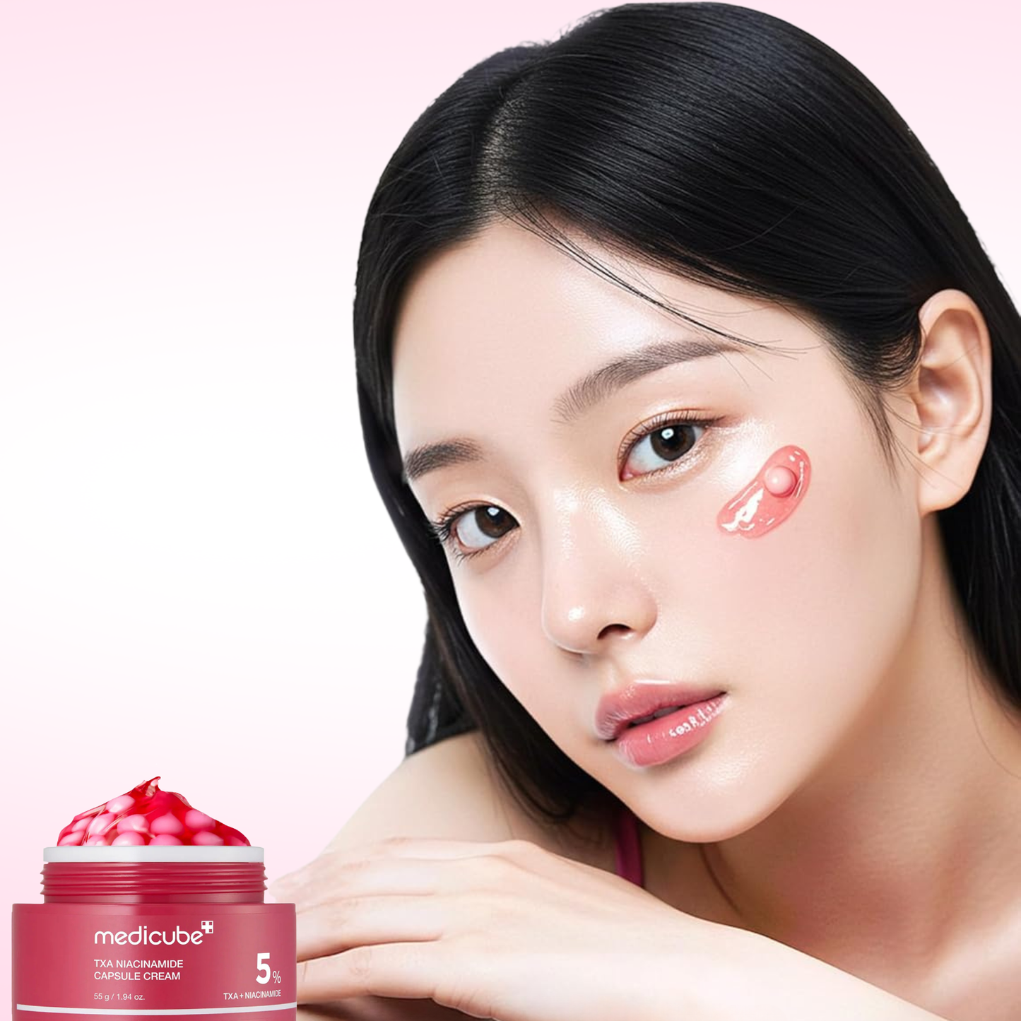 Woman with Medicube TXA Niacinamide Capsule Cream on her cheek with a jar of capsule cream in the foreground