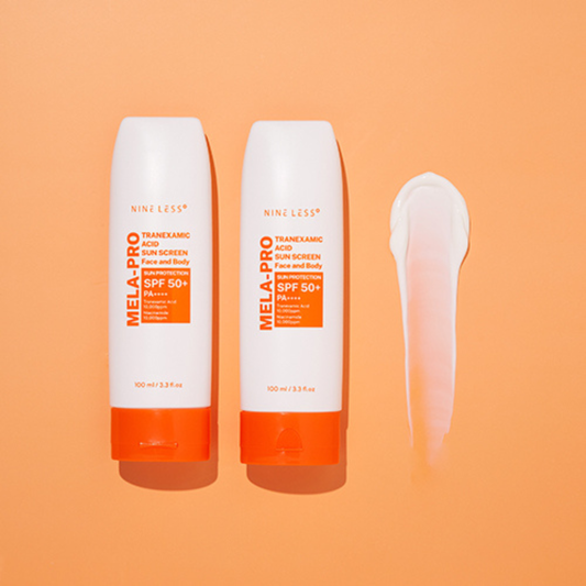 Two bottles of Nine Less Mela-Pro sunscreen on an orange background