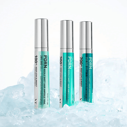 Three PDRN Reedle Shot Hair Ampoules in different strengths on a textured white background
