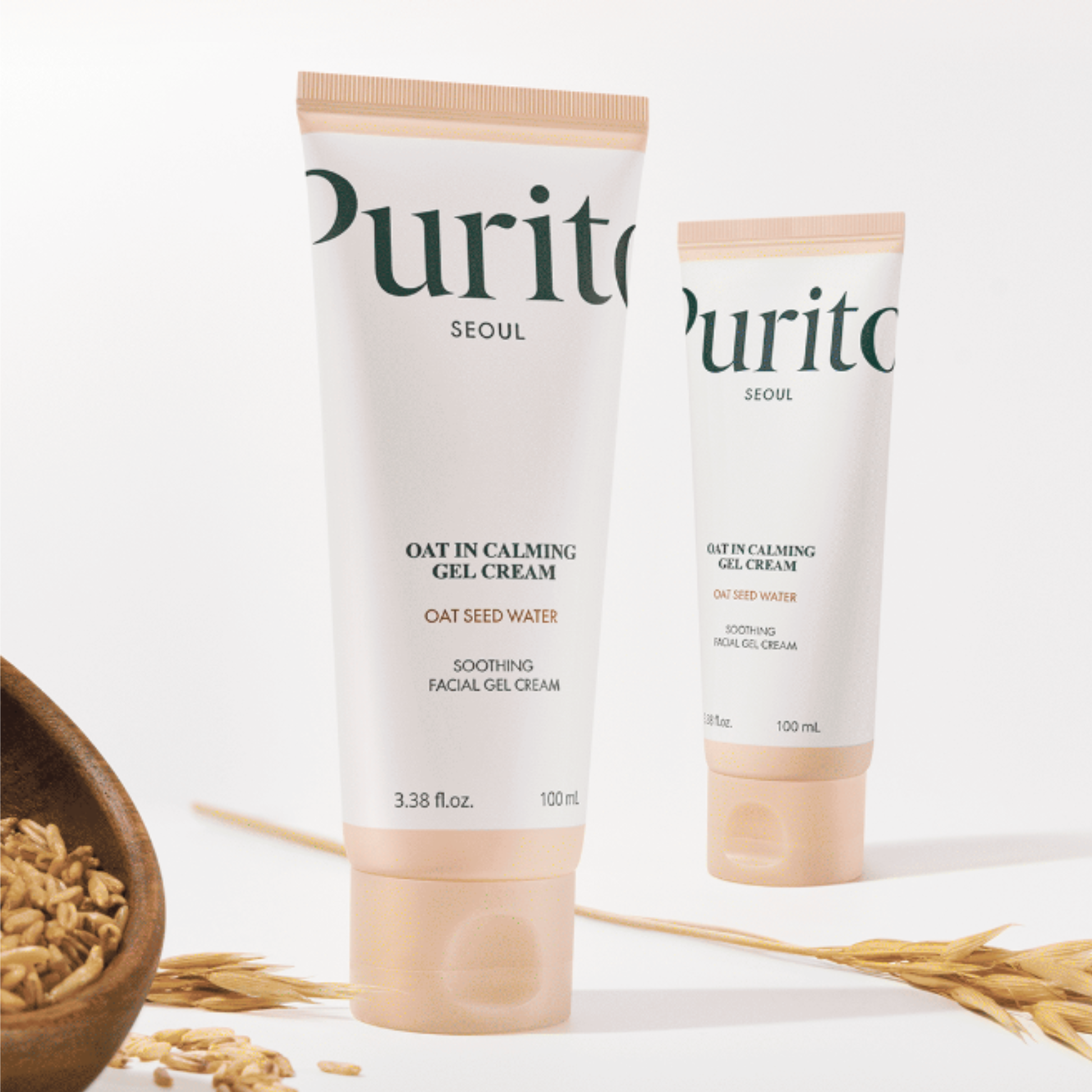 Two tubes of Purito Seoul Oat in Calming Gel Cream on a white background with oats.