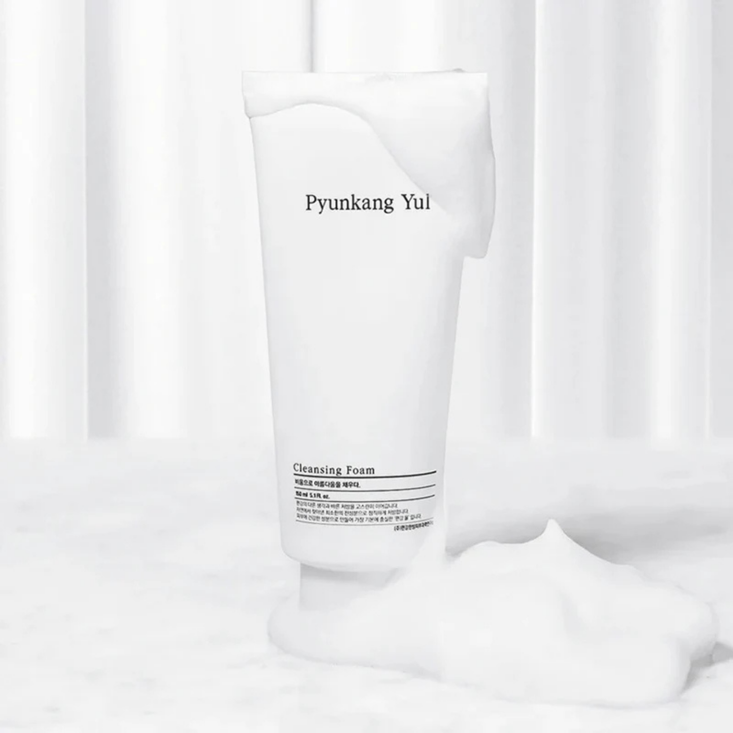 Pyunkang Yul Cleansing Foam tube with foam on a white background