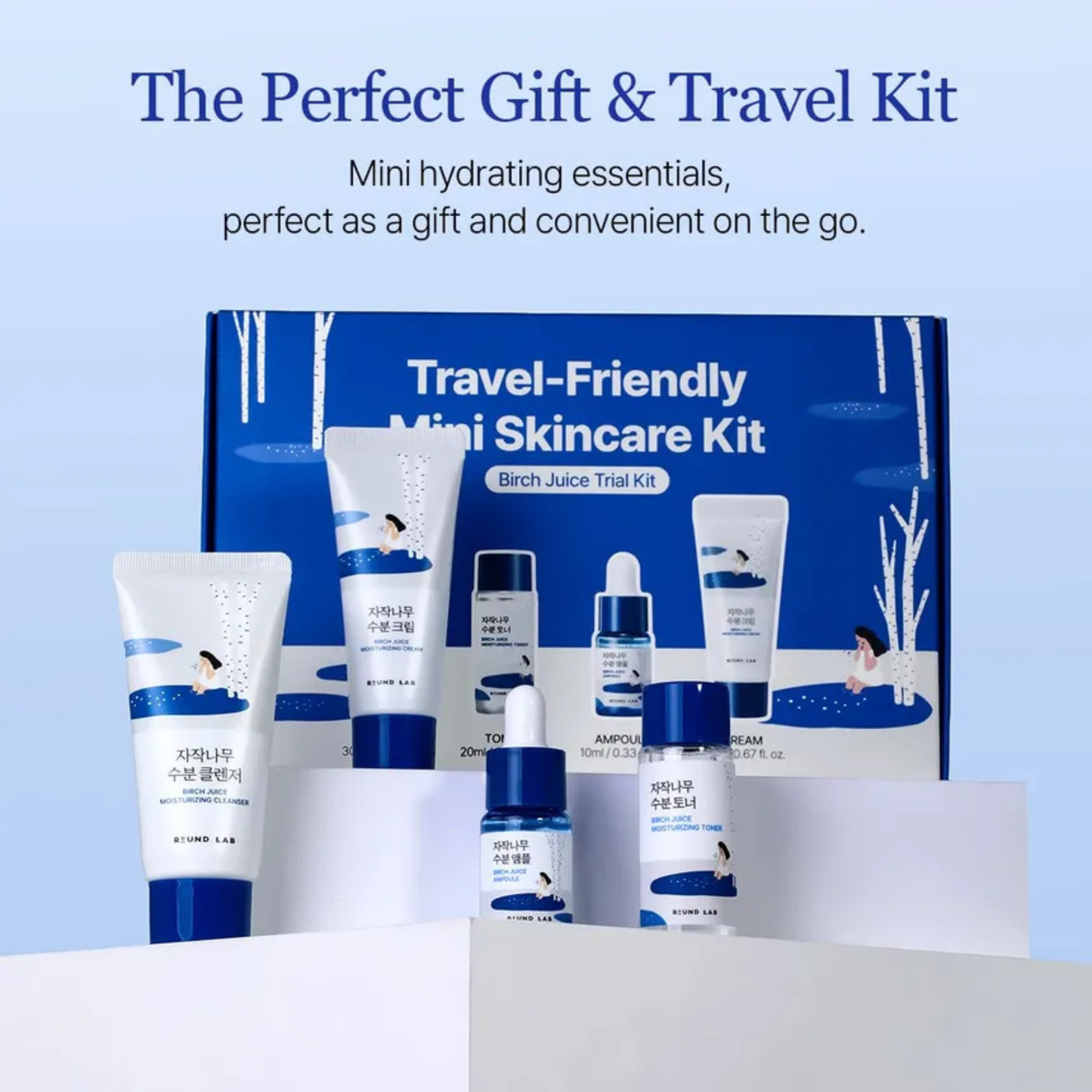 Round Lab Birch Juice Travel-friendly mini skincare kit with products and packaging on a light blue background