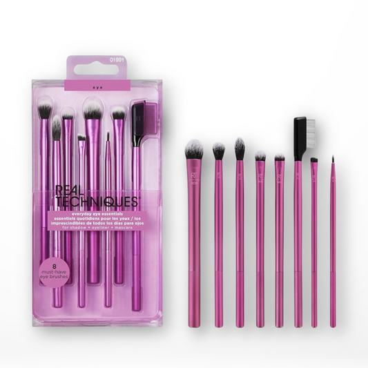 Real Techniques Everyday Eye Essentials Set, containing 8 makeup brushes with pink handles, displayed both in and out of packaging.