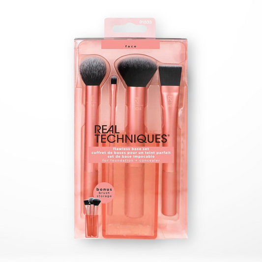 Real Techniques Flawless Face Base Set packaging containing four makeup brushes with rose gold handles and synthetic bristles, displayed in a clear plastic case.