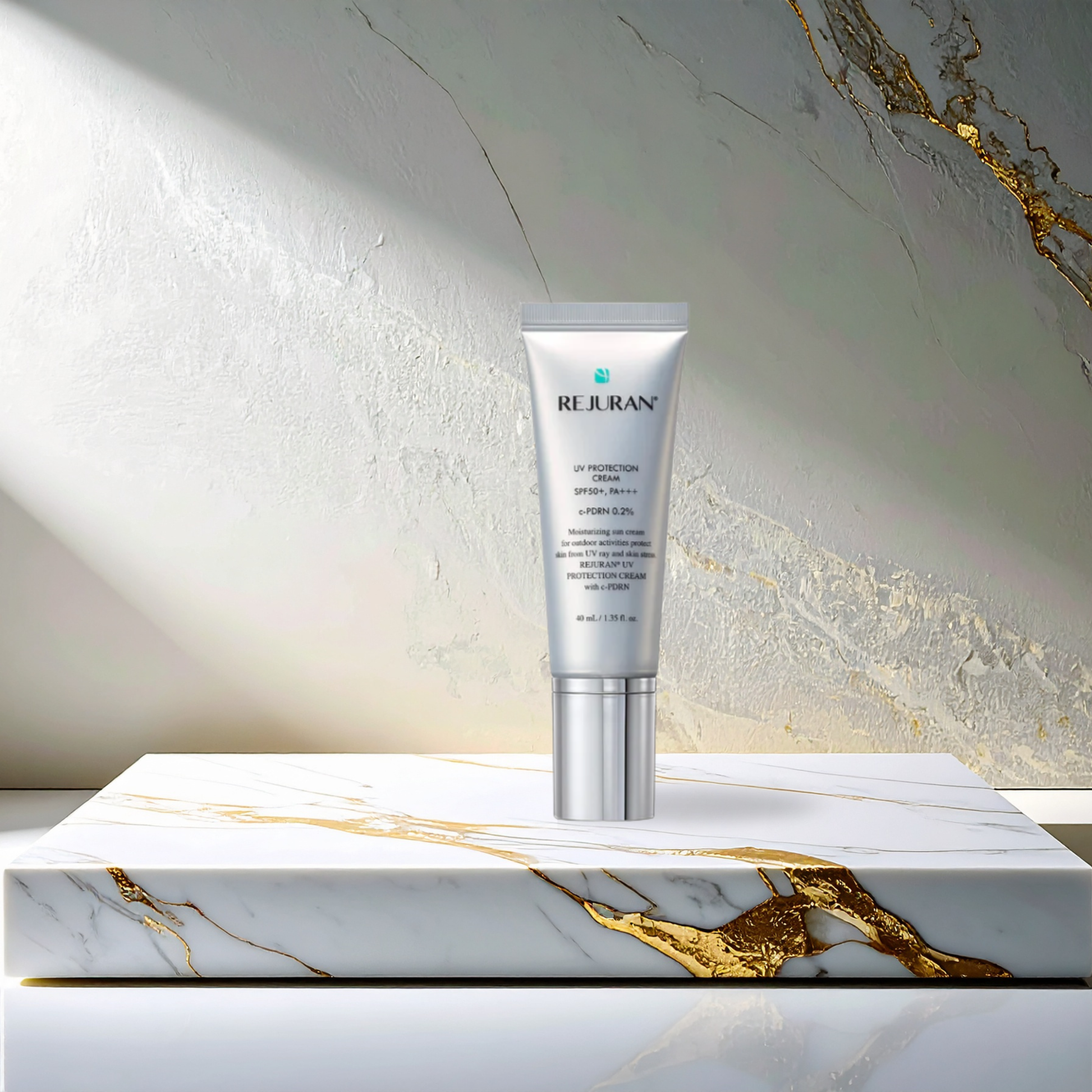 Rejuran UV Protection Cream SPF50+ PA+++ ona marble platform with gold inlay and a stone and marble background