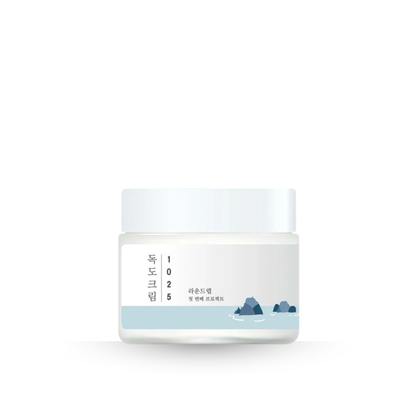 WhiteRound Lab 1025 Dokdo Cream jar with blue accents on a white background
