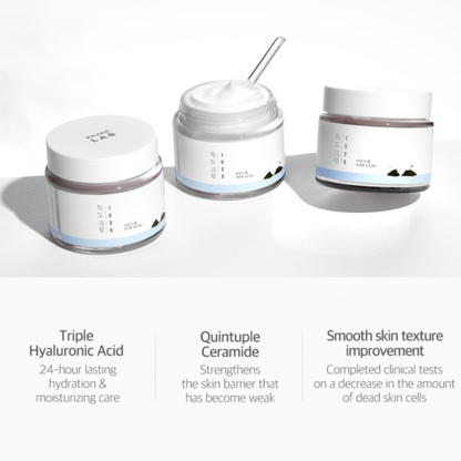 Three Round Lab 1025 Dokdo Cream jars with labels on a white background