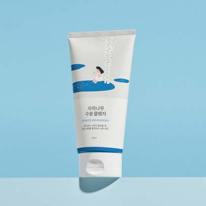 Tube of Round Lab Birch Juice Moisturizing Cleanser with blue and white design on a light blue background
